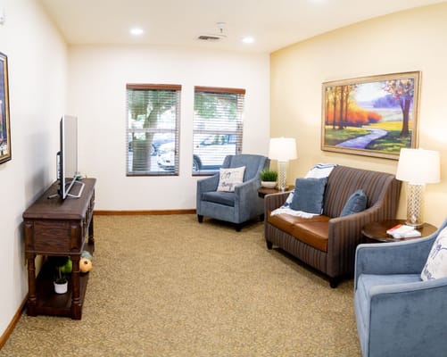 Cozy common area with seating and artwork