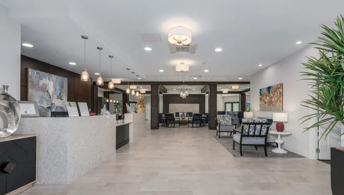 Inviting lobby area at Atrium at Liberty Park with seating and decor.