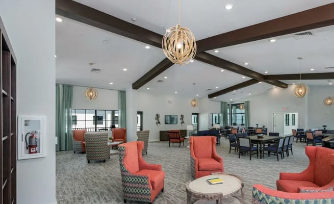 Spacious common area with seating and tables