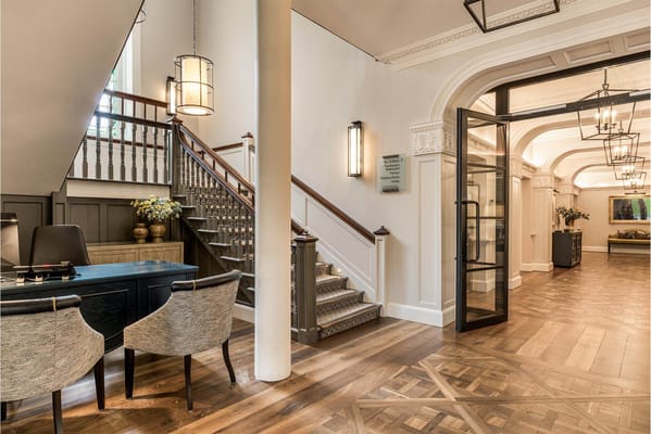 Elegant lobby interior with staircase and reception area