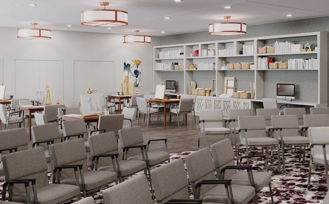 Bright activity room with tables and chairs