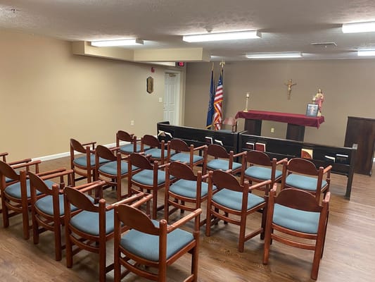 Chairs arranged in a small chapel setting