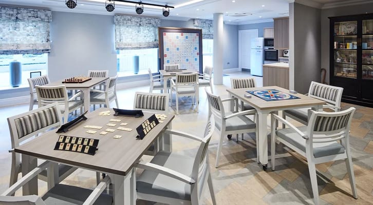 Bright activity room with tables and games