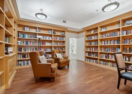 Cozy library with bookshelves and seating