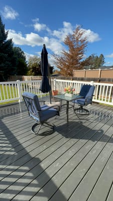 Outdoor seating area with a table and chairs