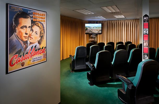 Interior of a theater room with Casablanca poster