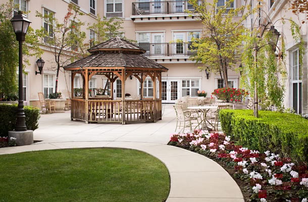 Outdoor gazebo and seating area in a landscaped courtyard