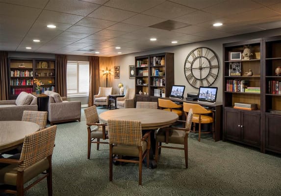 Bright common area with seating and bookshelves