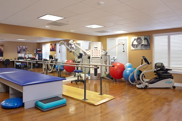 Interior view of the therapy room featuring exercise equipment.