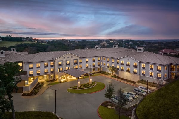 Aerial view of a senior living facility at dusk