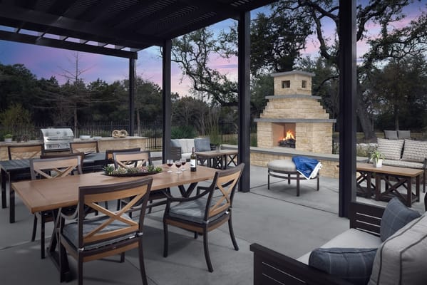 Outdoor seating area with grill and fireplace