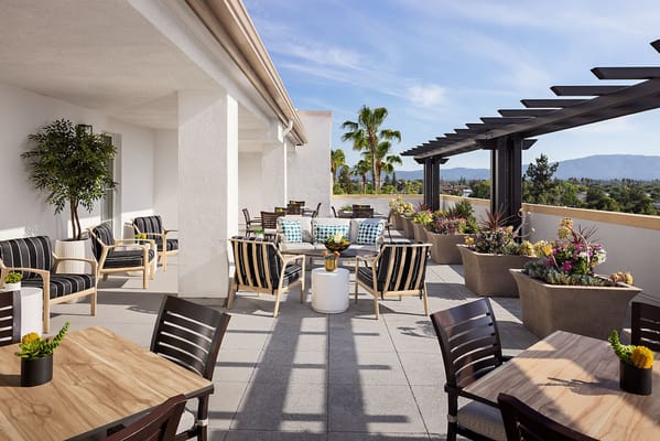 Outdoor seating area with plants and views