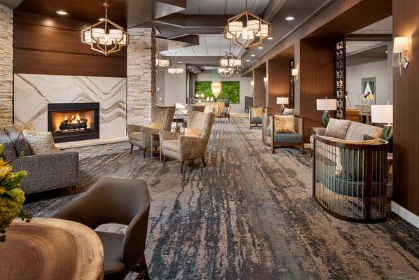 Lounge area with comfortable seating and a fireplace