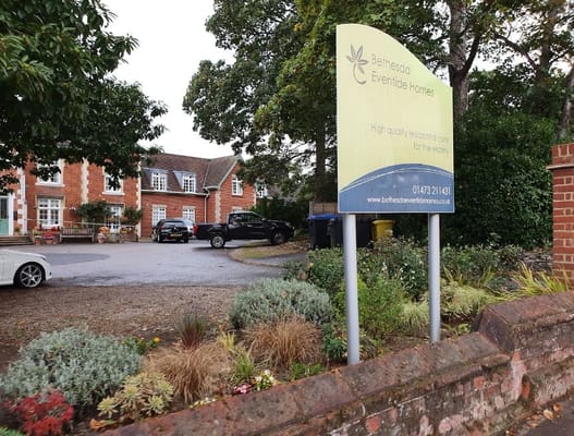 Exterior view of Bethesda Eventide Homes signage and gardens
