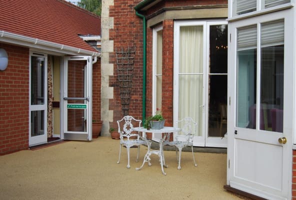 Outdoor seating area with chairs and a small table
