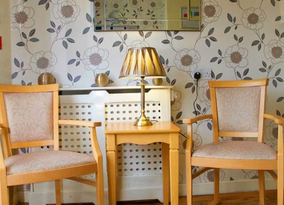 Cozy seating area with chairs and lamp