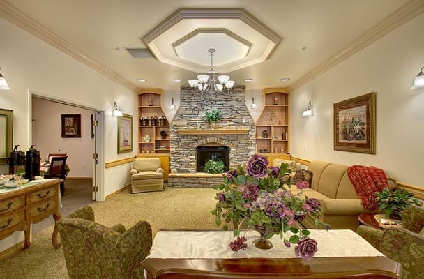 Interior common area with cozy seating and a fireplace