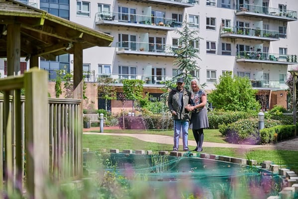 Couple walking in the garden area of the retirement village