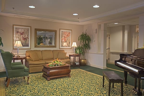 Cozy common area with seating and piano