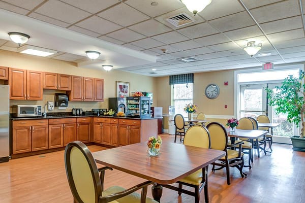 Bright dining area with wooden tables and chairs