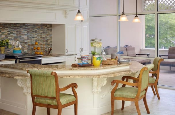 Bright and welcoming kitchen area with seating.