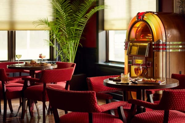 Cozy interior space with jukebox and dining tables