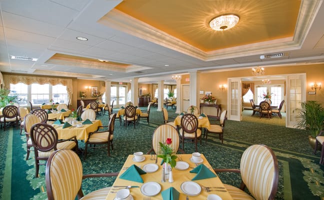 Elegant dining room setup with tables and chairs