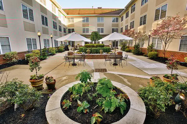 Beautiful outdoor courtyard with seating and flowers