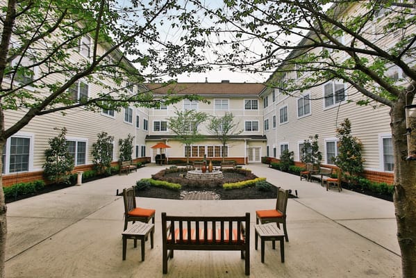 Outdoor courtyard with benches and landscaping