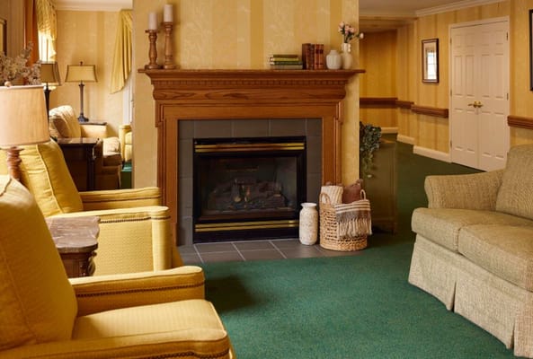 Cozy common area with a fireplace and seating