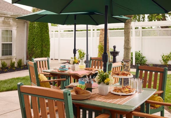 Outdoor dining setup with food and umbrellas