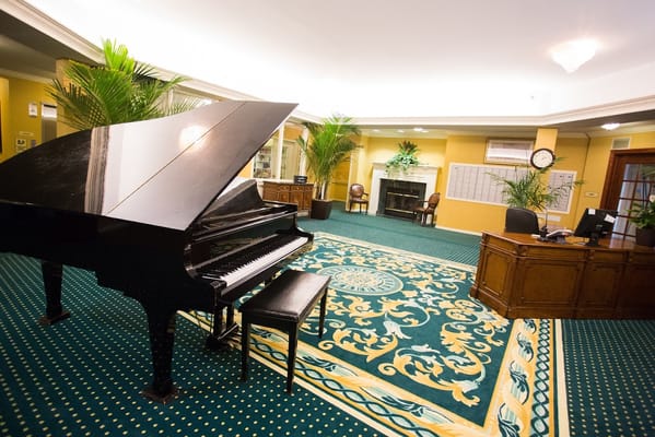 Elegant lobby area with a piano and decorative elements
