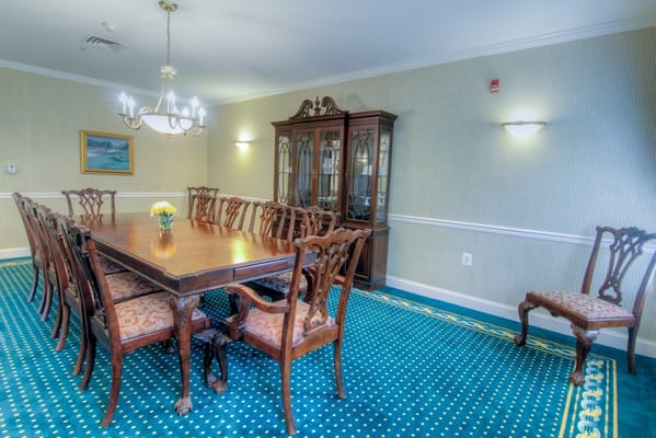 Dining room with a large wooden table and chairs