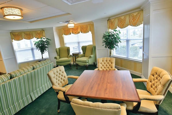 Bright common area with seating and natural light