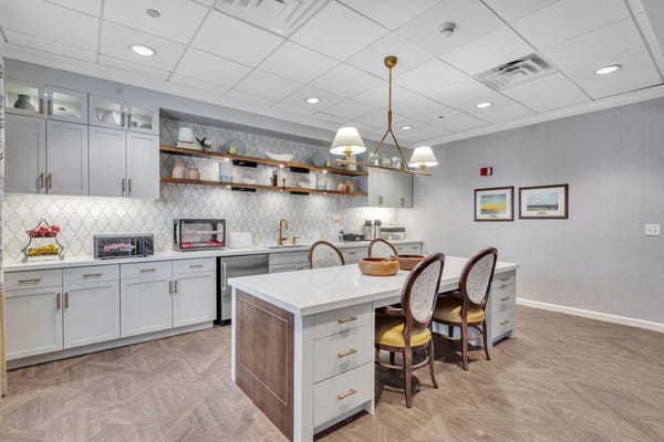 Bright kitchen area with seating and appliances
