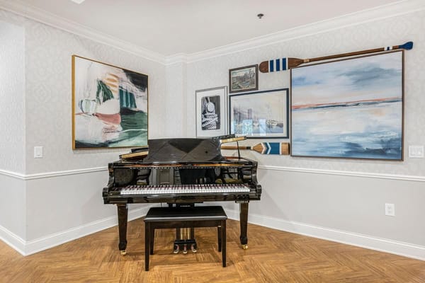 Elegant interior space featuring a piano and artwork