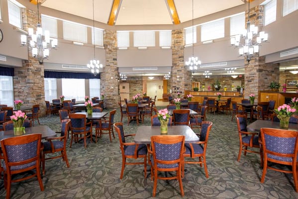 Dining room area with tables and flowers