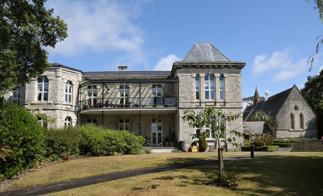 Exterior view of Brompton Court with gardens