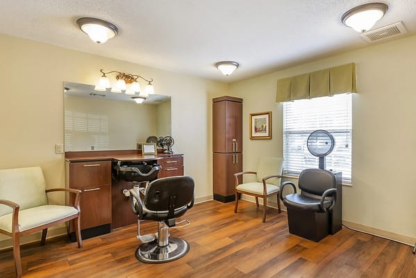 Interior view of a salon with styling chairs and mirrors