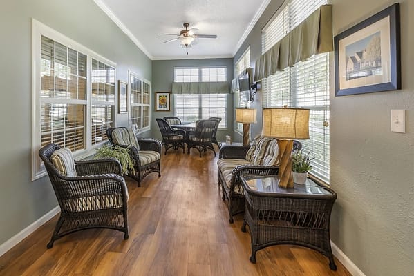 Cozy common area with wicker furniture and natural light