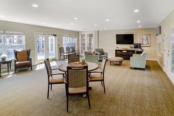 Bright common area with seating and tables