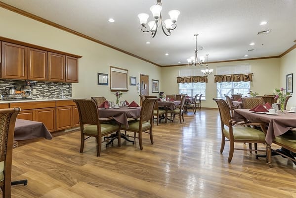 Bright dining area with tables set for meals