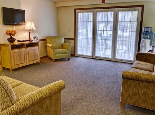 Comfortable lounge area with seating and a TV