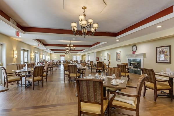 Interior view of a dining room with tables and chairs