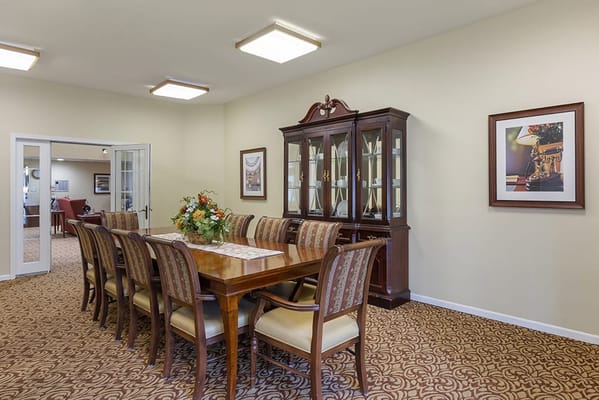 Dining room with a large wooden table and chairs