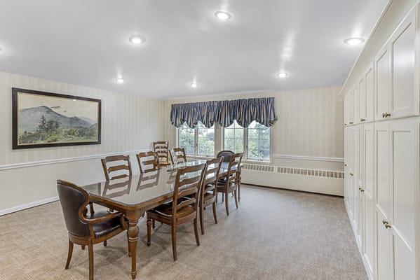 Bright dining room with a large table and chairs