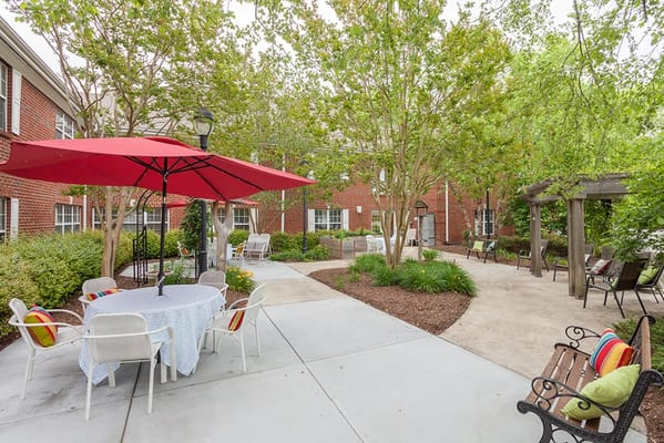 Outdoor seating area with tables and umbrellas