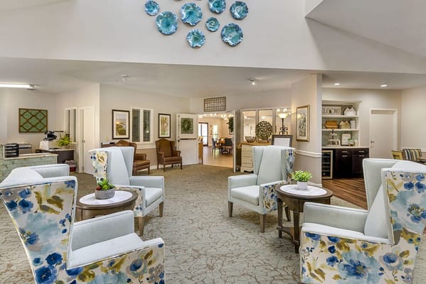Bright interior common area with floral chairs