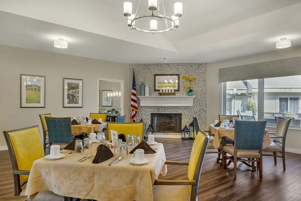 Bright dining room with tables set for a meal