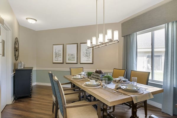 Bright dining room with a beautifully set table